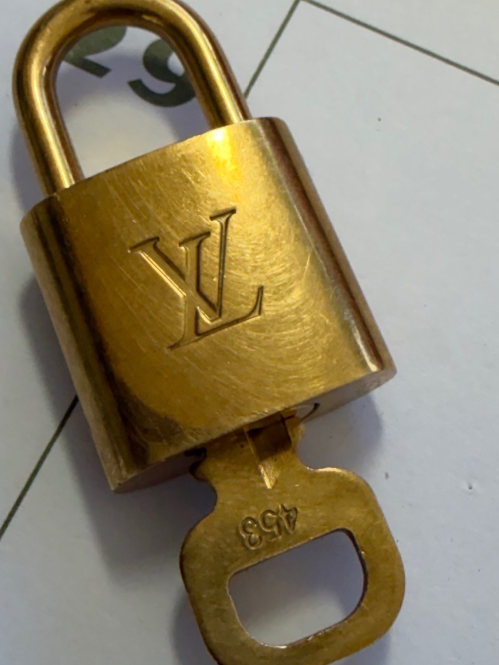 Louis Vuitton Padlock & key set #453. Brass